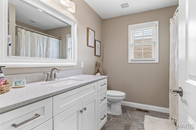 105 Shepherd Mountain Rd, Farmington, MO 63640 - full bath with baseboards, vanity, toilet, and stone tile floors