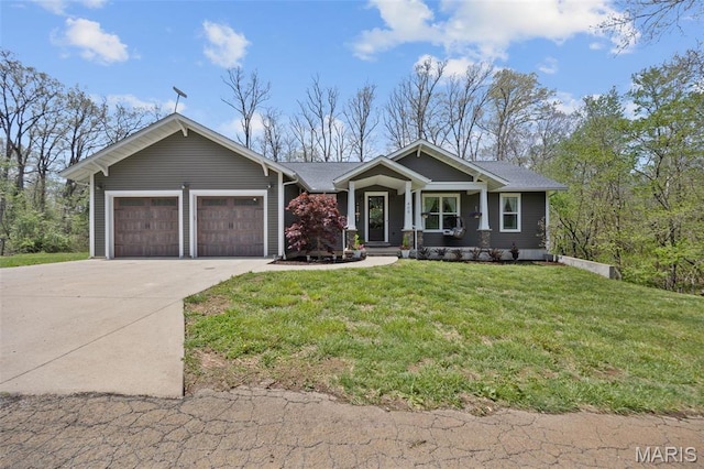 409 Pawnee Dr, Irondale, MO 63648 - view of front of property featuring driveway, an attached garage, and a front yard