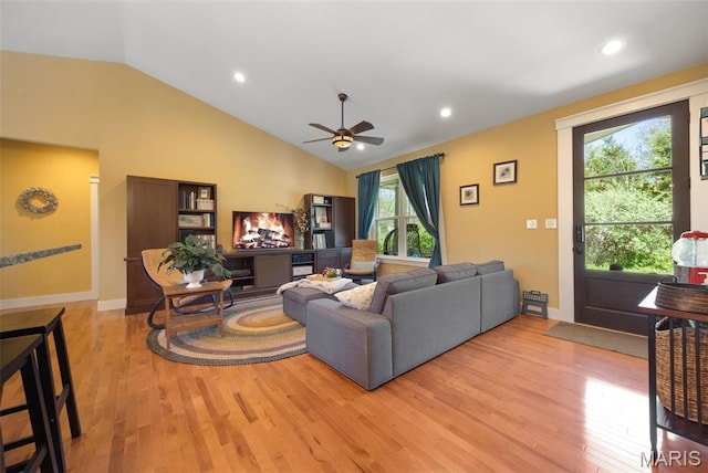 409 Pawnee Dr, Irondale, MO 63648 - living room with light wood-style flooring, ceiling fan, recessed lighting, baseboards, and high vaulted ceiling