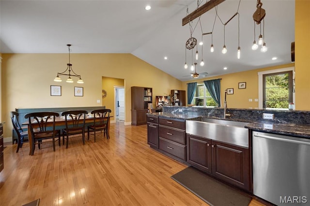 409 Pawnee Dr, Irondale, MO 63648 - kitchen featuring dishwasher, a sink, vaulted ceiling, light wood-type flooring, and pendant lighting