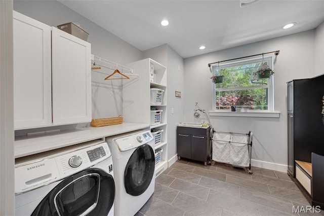 409 Pawnee Dr, Irondale, MO 63648 - laundry room featuring washing machine and clothes dryer, cabinet space, baseboards, and recessed lighting