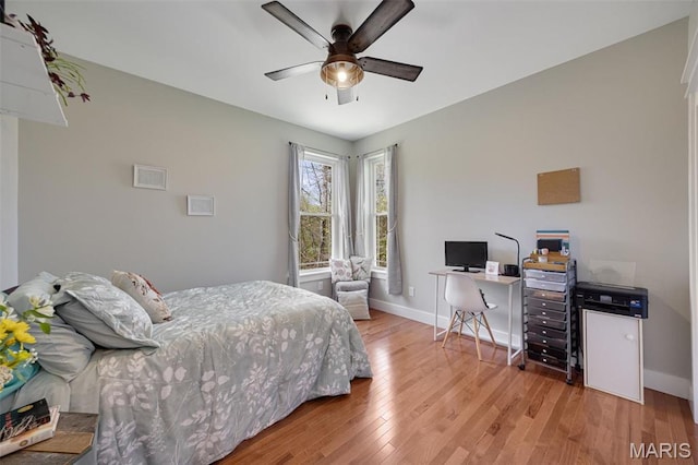 409 Pawnee Dr, Irondale, MO 63648 - bedroom with light wood-style floors, baseboards, an office area, and ceiling fan