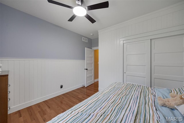 409 Pawnee Dr, Irondale, MO 63648 - unfurnished bedroom featuring wood finished floors, baseboards, a ceiling fan, and a closet