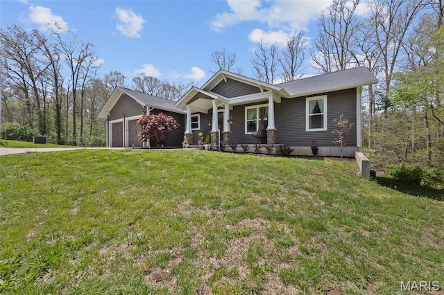 409 Pawnee Dr, Irondale, MO 63648 - craftsman house with an attached garage, covered porch, and a front yard