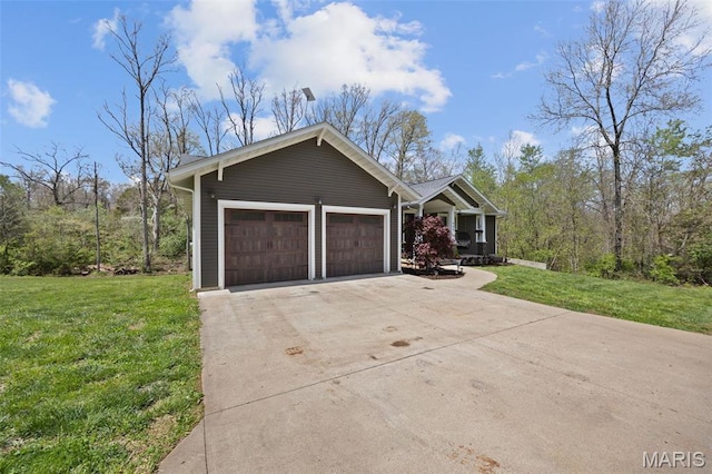409 Pawnee Dr, Irondale, MO 63648 - view of front of property featuring a front lawn, driveway, and a garage