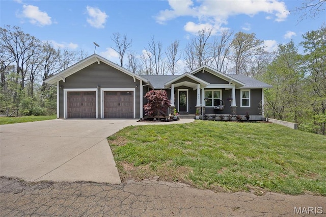 409 Pawnee Dr, Irondale, MO 63648 - view of front of property with a garage, driveway, a front lawn, and a porch
