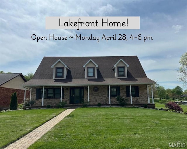 14 Sierra Dr, Glen Carbon, IL 62034 - view of front of house featuring a porch, a front lawn, and brick siding