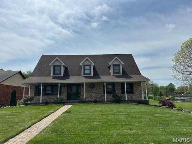14 Sierra Dr, Glen Carbon, IL 62034 - cape cod home featuring covered porch, a front yard, and stone siding