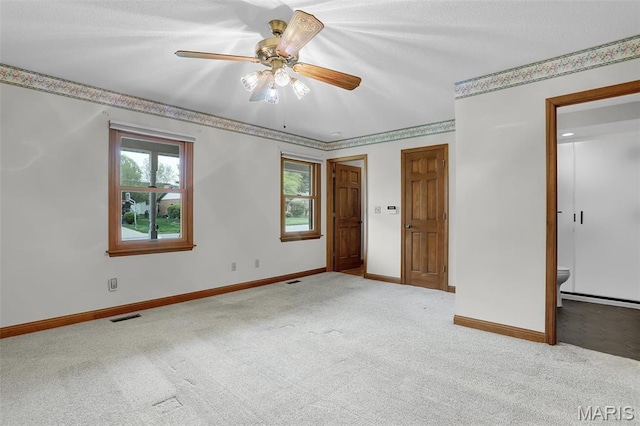 14 Sierra Dr, Glen Carbon, IL 62034 - carpeted empty room featuring baseboards and a ceiling fan