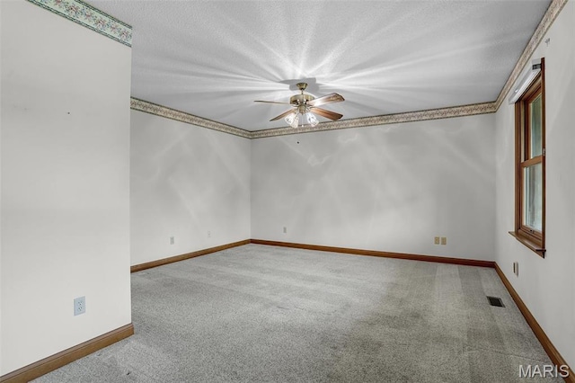 14 Sierra Dr, Glen Carbon, IL 62034 - carpeted spare room with a ceiling fan, baseboards, and a textured ceiling