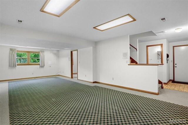 14 Sierra Dr, Glen Carbon, IL 62034 - spare room with carpet flooring, baseboards, and stairway