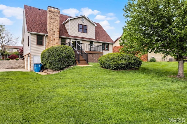 14 Sierra Dr, Glen Carbon, IL 62034 - rear view of house featuring stairs, a garage, a chimney, and a yard