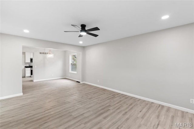 11735 Old Halls Ferry Rd, Florissant, MO 63033 - unfurnished room with light wood-style flooring, a ceiling fan, baseboards, and recessed lighting