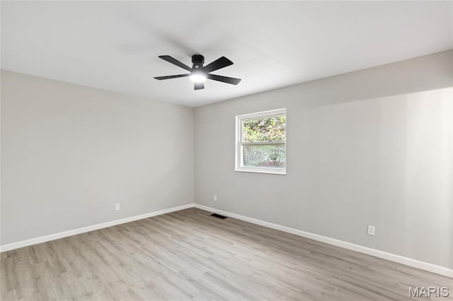 11735 Old Halls Ferry Rd, Florissant, MO 63033 - unfurnished room with wood finished floors, baseboards, and a ceiling fan