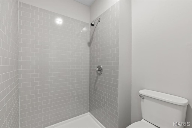 11735 Old Halls Ferry Rd, Florissant, MO 63033 - bathroom featuring a tile shower and toilet