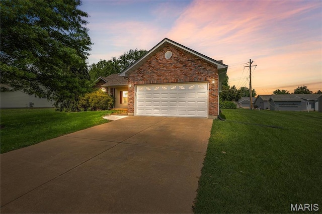 601 John David Dr, Farmington, MO 63640 - view of front of home with driveway, a front lawn, a garage, and brick siding