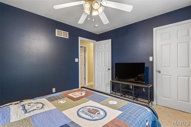 601 John David Dr, Farmington, MO 63640 - carpeted bedroom featuring a textured wall and ceiling fan