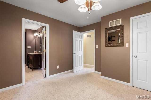 601 John David Dr, Farmington, MO 63640 - unfurnished bedroom with carpet floors, baseboards, and connected bathroom