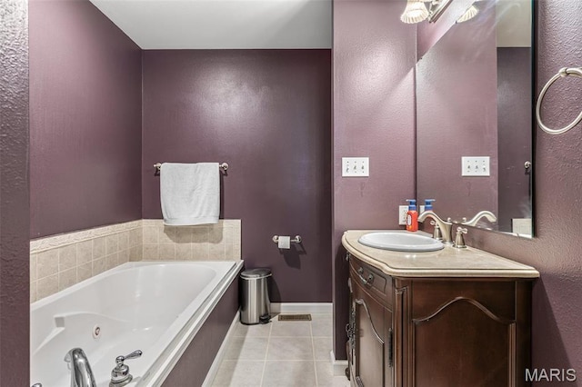 601 John David Dr, Farmington, MO 63640 - bathroom with tile patterned floors, a tub with jets, vanity, and baseboards