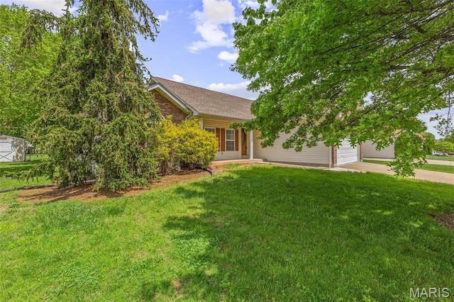 601 John David Dr, Farmington, MO 63640 - obstructed view of property featuring an attached garage, concrete driveway, a front lawn, and roof with shingles