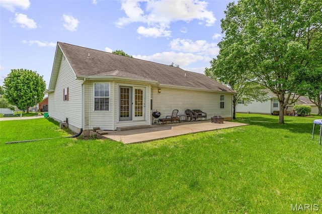 601 John David Dr, Farmington, MO 63640 - back of house with a patio, a lawn, and roof with shingles