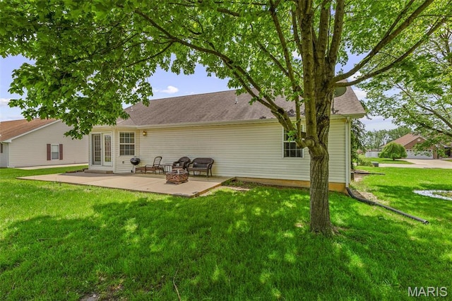 601 John David Dr, Farmington, MO 63640 - back of property featuring a patio area and a lawn
