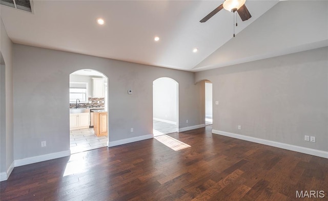 11175 Lexington Ln, Rolla, MO 65401 - unfurnished room with a ceiling fan, lofted ceiling, recessed lighting, arched walkways, and wood finished floors