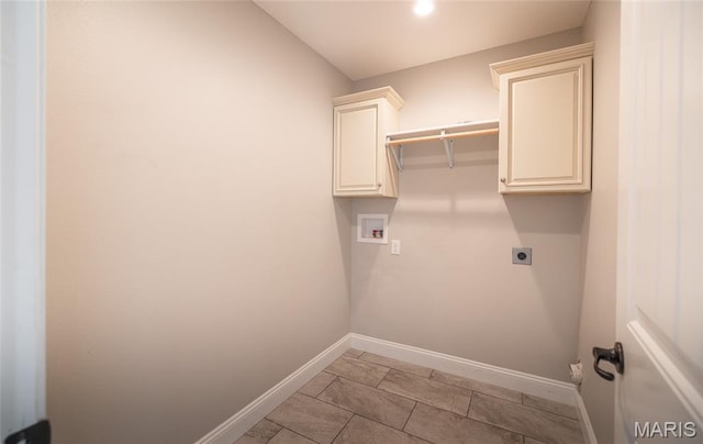 11175 Lexington Ln, Rolla, MO 65401 - washroom with baseboards, hookup for a washing machine, hookup for an electric dryer, and cabinet space