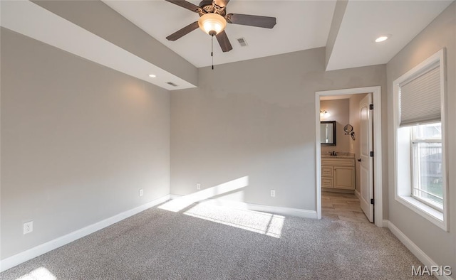 11175 Lexington Ln, Rolla, MO 65401 - unfurnished bedroom with light colored carpet, baseboards, connected bathroom, recessed lighting, and ceiling fan
