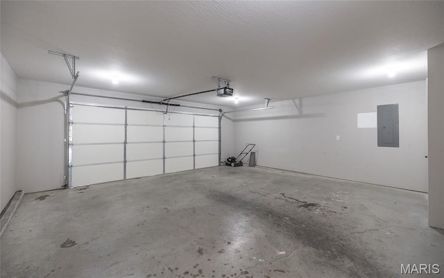 11175 Lexington Ln, Rolla, MO 65401 - garage featuring electric panel and a garage door opener