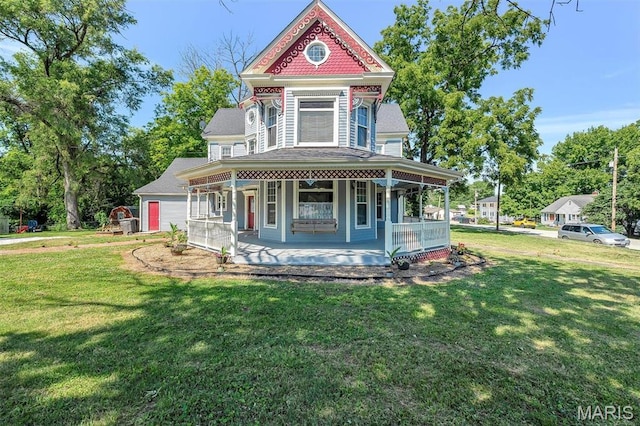 100 Lewis St, Troy, MO 63379 - victorian house featuring a porch, a front lawn, and a shingled roof