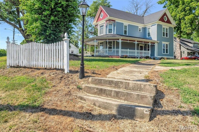 100 Lewis St, Troy, MO 63379 - victorian-style house with covered porch and a front lawn