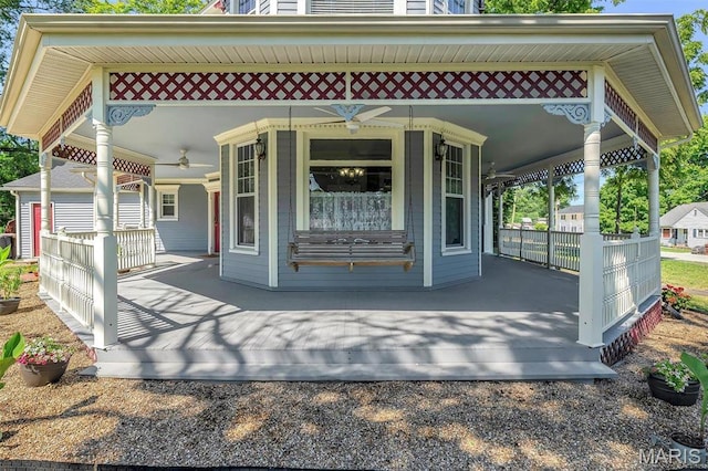 100 Lewis St, Troy, MO 63379 - back of house with covered porch and ceiling fan