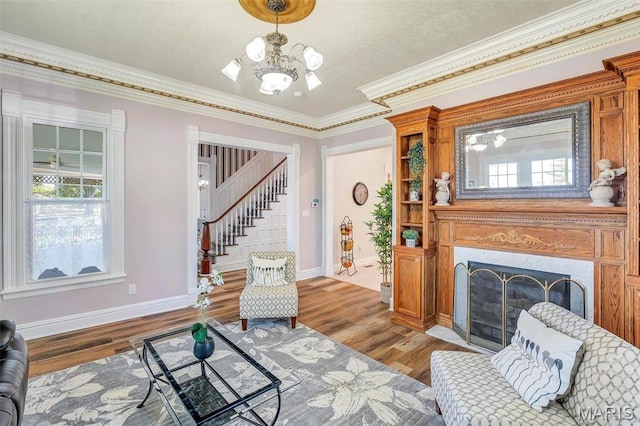 100 Lewis St, Troy, MO 63379 - living area featuring stairway, baseboards, a chandelier, healthy amount of natural light, and ornamental molding