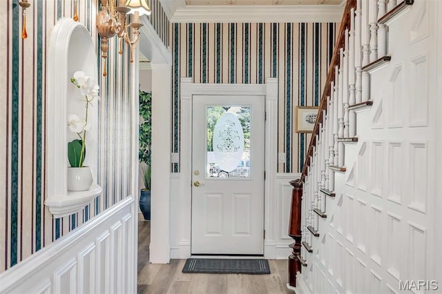 100 Lewis St, Troy, MO 63379 - entrance foyer with wallpapered walls, stairs, light wood-style floors, and ornamental molding