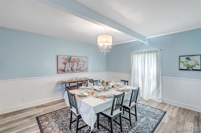 100 Lewis St, Troy, MO 63379 - dining room with beam ceiling, a chandelier, wood finished floors, and baseboards
