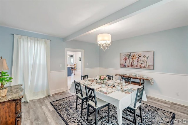 100 Lewis St, Troy, MO 63379 - dining area with light wood-style floors, beamed ceiling, and a chandelier