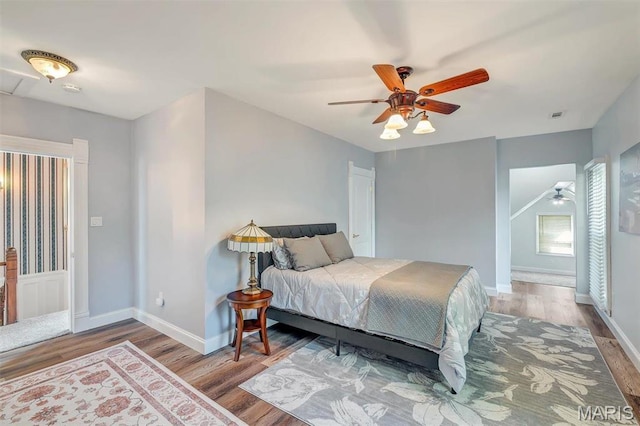 100 Lewis St, Troy, MO 63379 - bedroom featuring wood finished floors, baseboards, and a ceiling fan