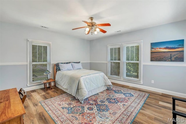 100 Lewis St, Troy, MO 63379 - bedroom featuring baseboards, wood finished floors, and a ceiling fan