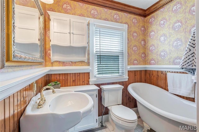 100 Lewis St, Troy, MO 63379 - full bath with wallpapered walls, wainscoting, a freestanding tub, toilet, and crown molding
