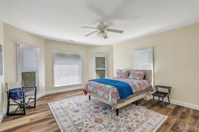 100 Lewis St, Troy, MO 63379 - bedroom with baseboards, wood finished floors, and a ceiling fan