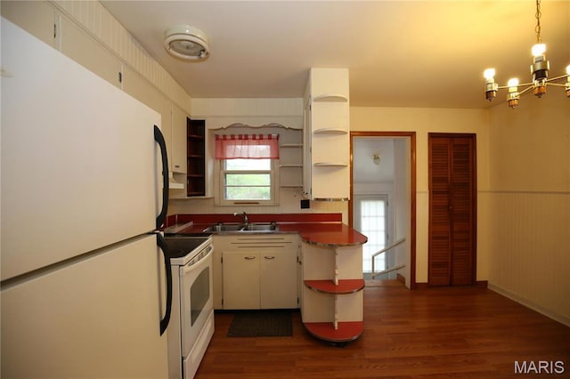 kitchen with white appliances, open shelves, a sink, a chandelier, and dark wood-style flooring