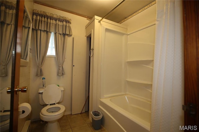 full bathroom with tile patterned flooring, toilet, and shower / tub combo with curtain