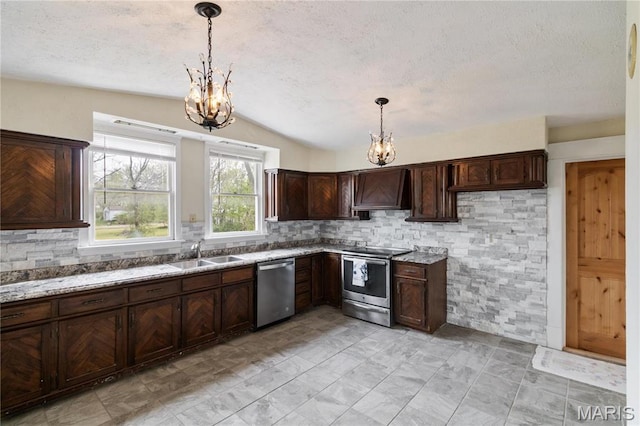 203 S B St, Bonne Terre, MO 63628 - kitchen featuring stainless steel appliances, a chandelier, a sink, premium range hood, and decorative backsplash