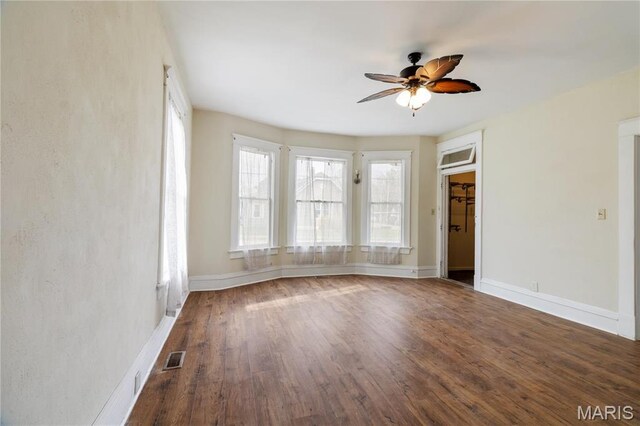 203 S B St, Bonne Terre, MO 63628 - empty room featuring a ceiling fan, wood finished floors, and baseboards