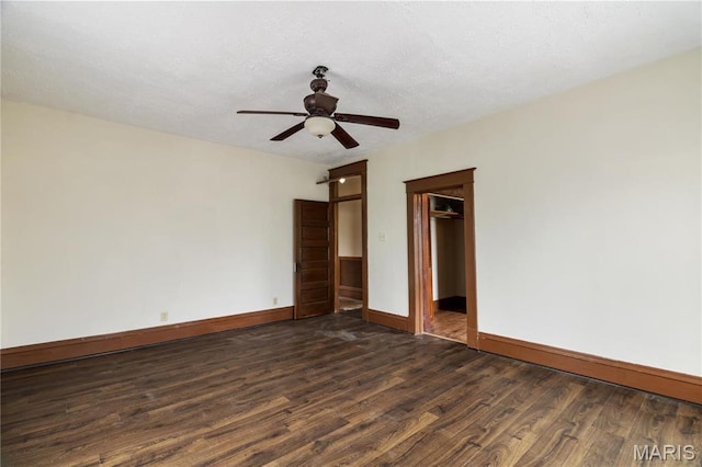 203 S B St, Bonne Terre, MO 63628 - unfurnished room with baseboards, dark wood finished floors, and ceiling fan