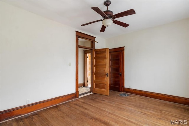 203 S B St, Bonne Terre, MO 63628 - unfurnished room with wood finished floors, baseboards, and a ceiling fan