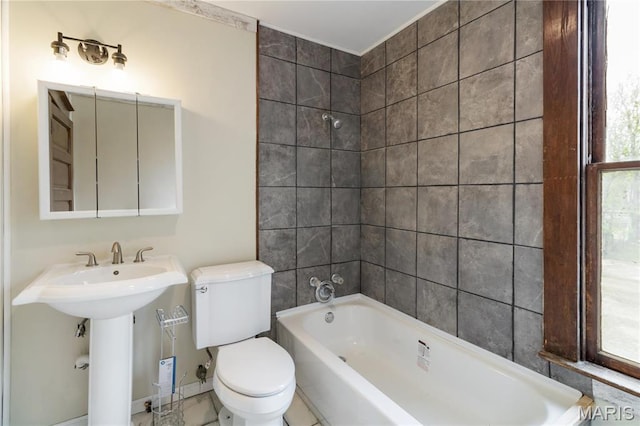 203 S B St, Bonne Terre, MO 63628 - bathroom featuring toilet, bathtub / shower combination, and a sink