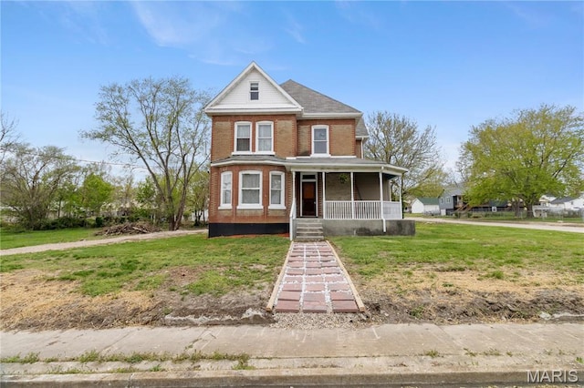203 S B St, Bonne Terre, MO 63628 - victorian home featuring a porch, brick siding, and a front yard