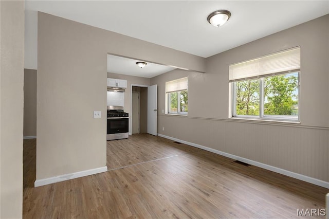 2126 Aristocrat Dr, Florissant, MO 63031 - empty room featuring light wood-style floors and baseboards